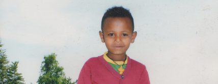 Foto di Lencho con una maglietta rossa