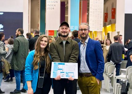 Part of the team that took part in the realisation of the project, posing with the ADI Design Index book.