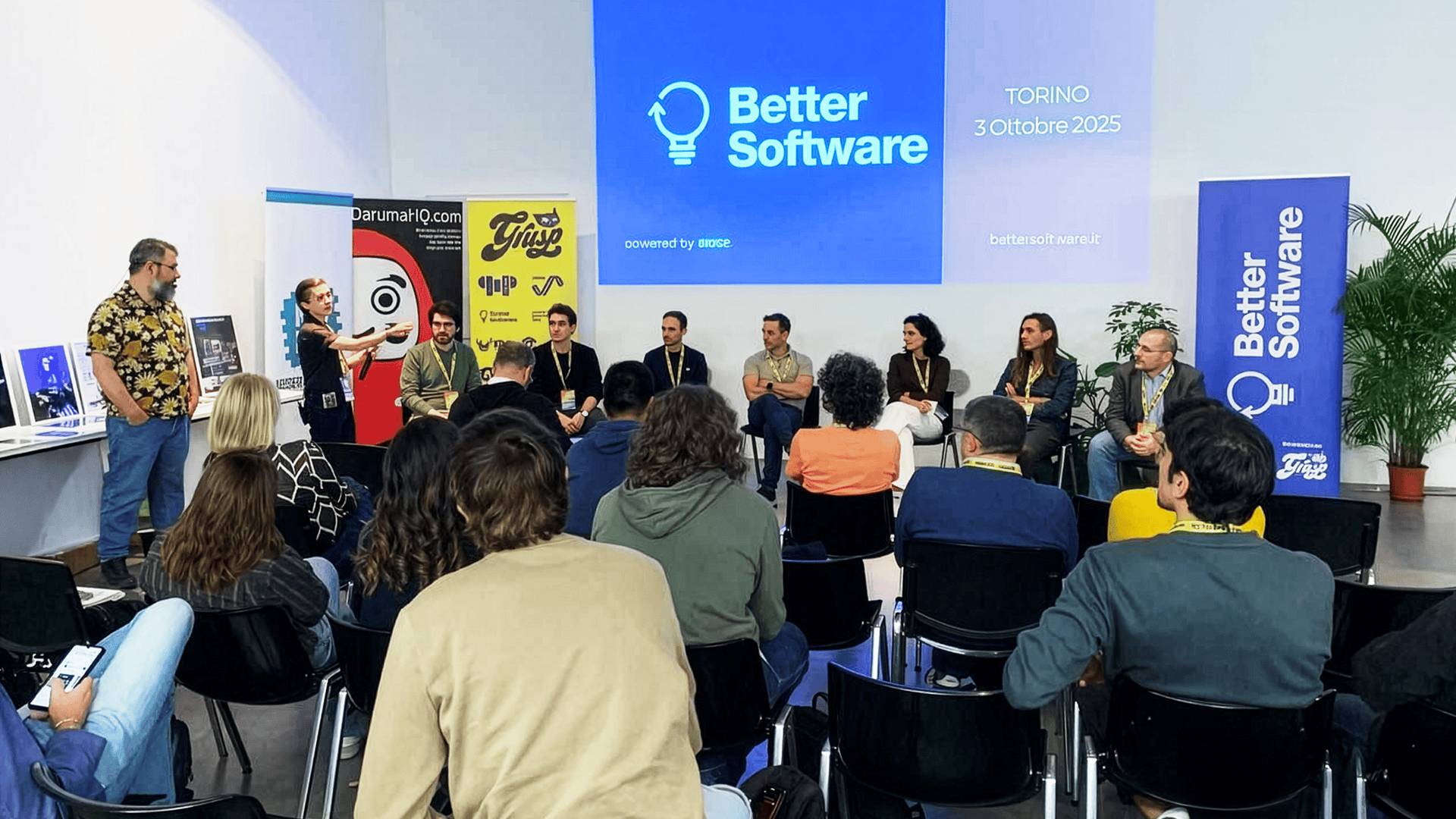 Persone sedute durante un talk di Better Software 2025 a Torino, con relatori sul palco. L’immagine rappresenta il contesto dell'intervento in cui è nata la riflessione del blogpost.
